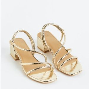 Sandals with square toes and covered block heels. New with tags. Sold out at HM!